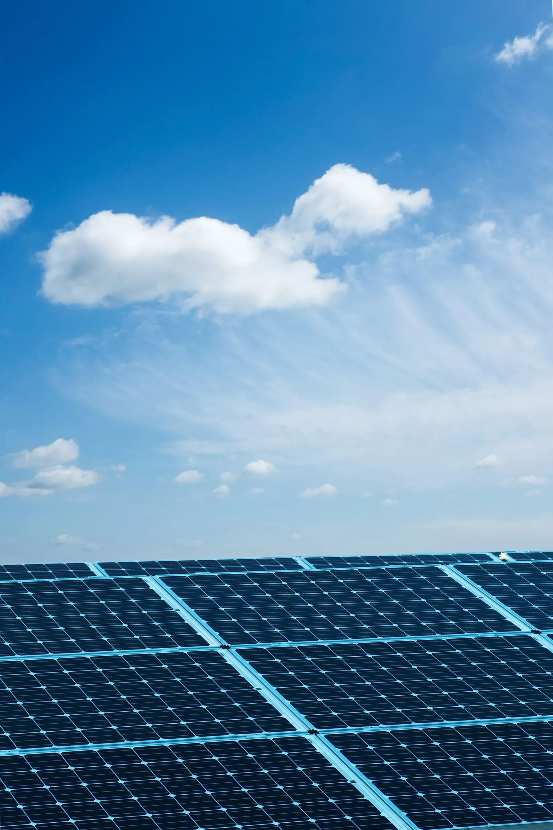 A solar PV array under a clear blue sky